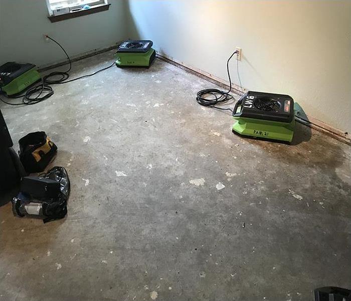 cement floor with three green air movers